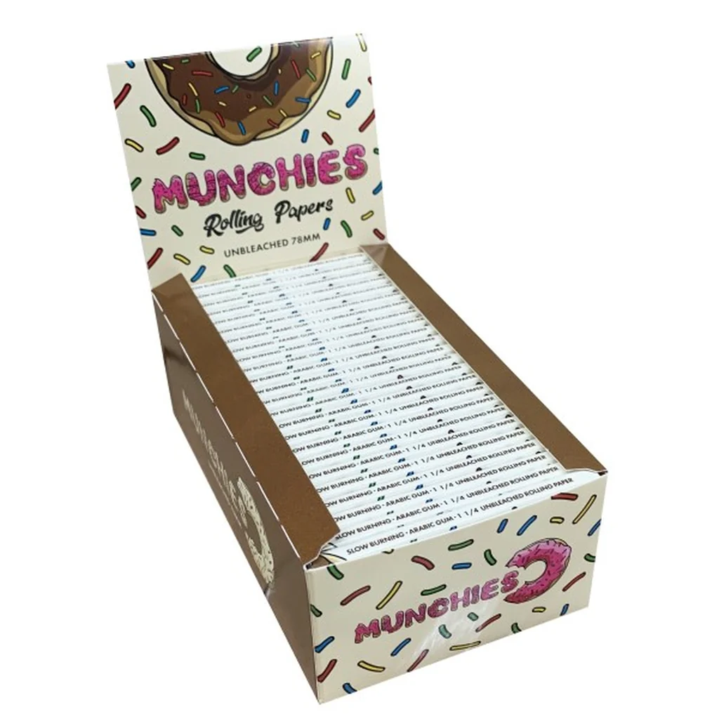 Expositor abierto de papel de liar Munchies sin blanquear, con libritos alineados y dibujos de donuts y virutas de colores.