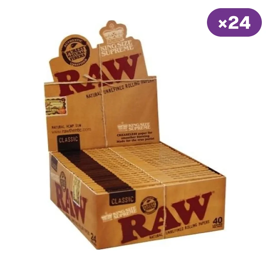 Caja expositora abierta de papel RAW Classic King Size Supreme, con varios librillos marrones y el distintivo de 24 unidades.