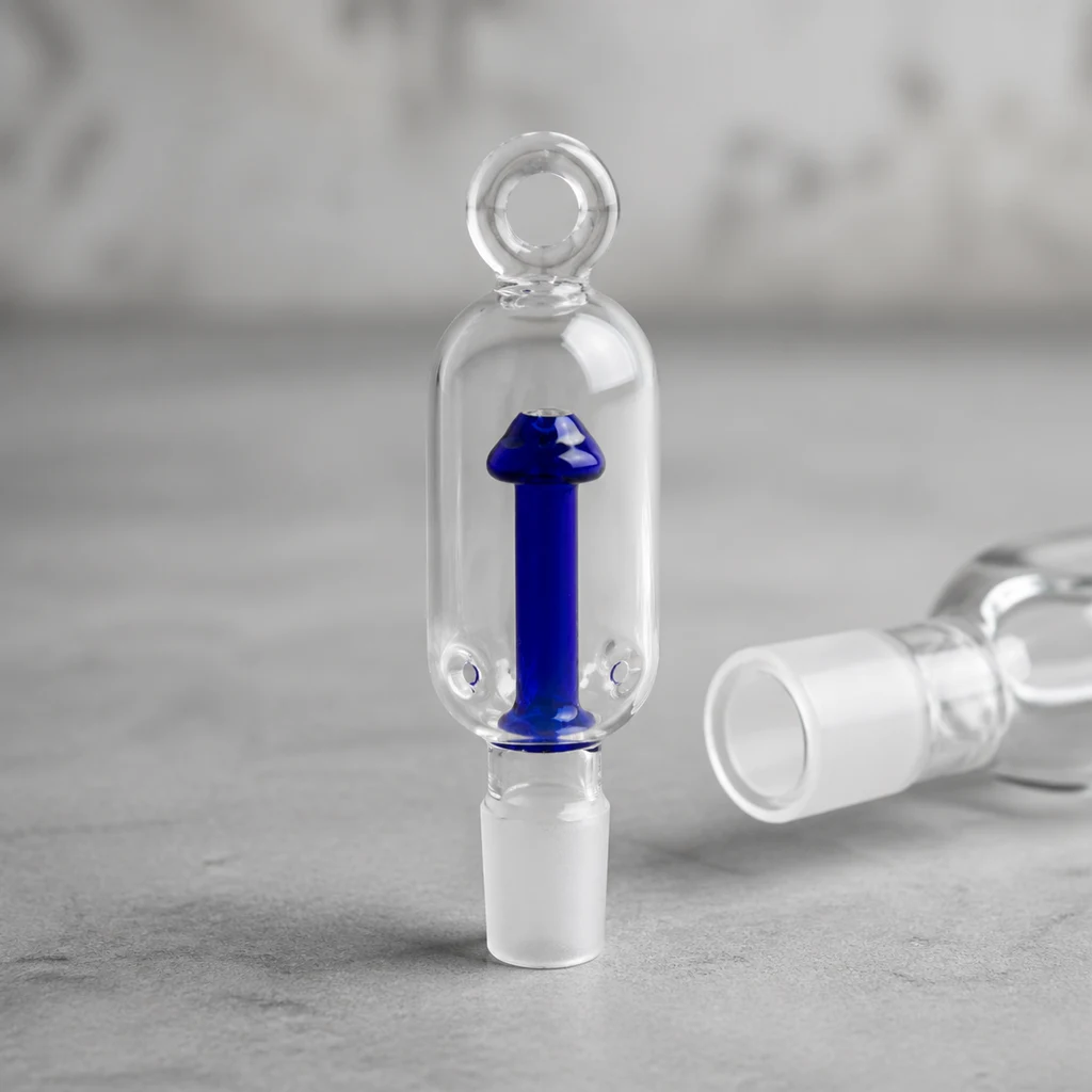 Percolador Psylocibe Blue transparente con pieza interior azul en forma de seta, anilla superior y junta inferior; otra pieza aparece tumbada detrás.