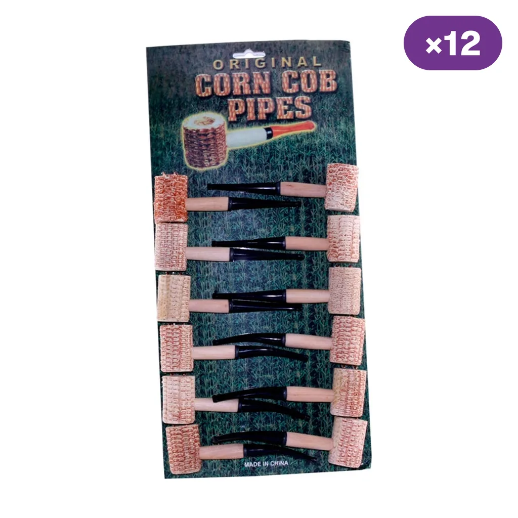 Expositor de pipas de mazorca con cazoletas claras, tubos beige y boquillas negras, sobre fondo blanco con distintivo «×12».