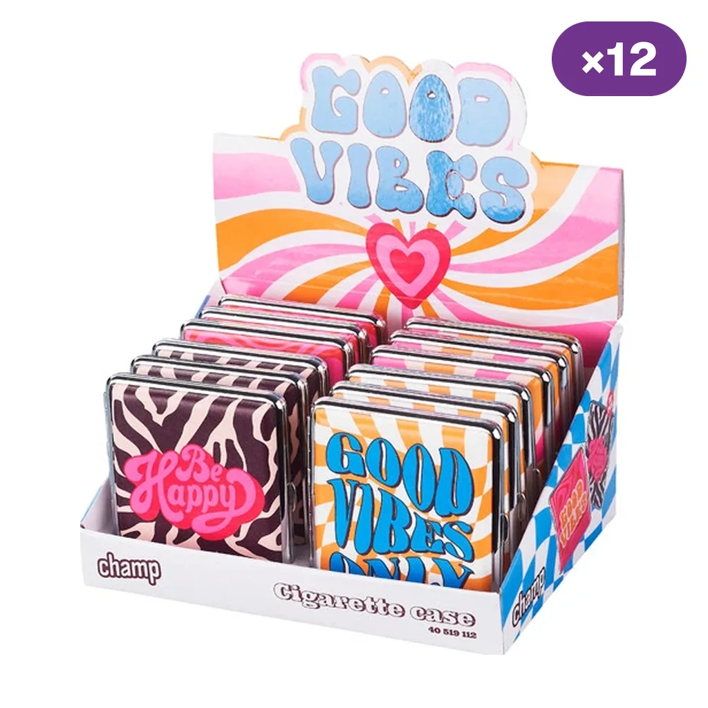 Expositor Champ con pitilleras de distintos estampados y mensajes «Be Happy» y «Good Vibes Only», con indicación de 12 unidades.