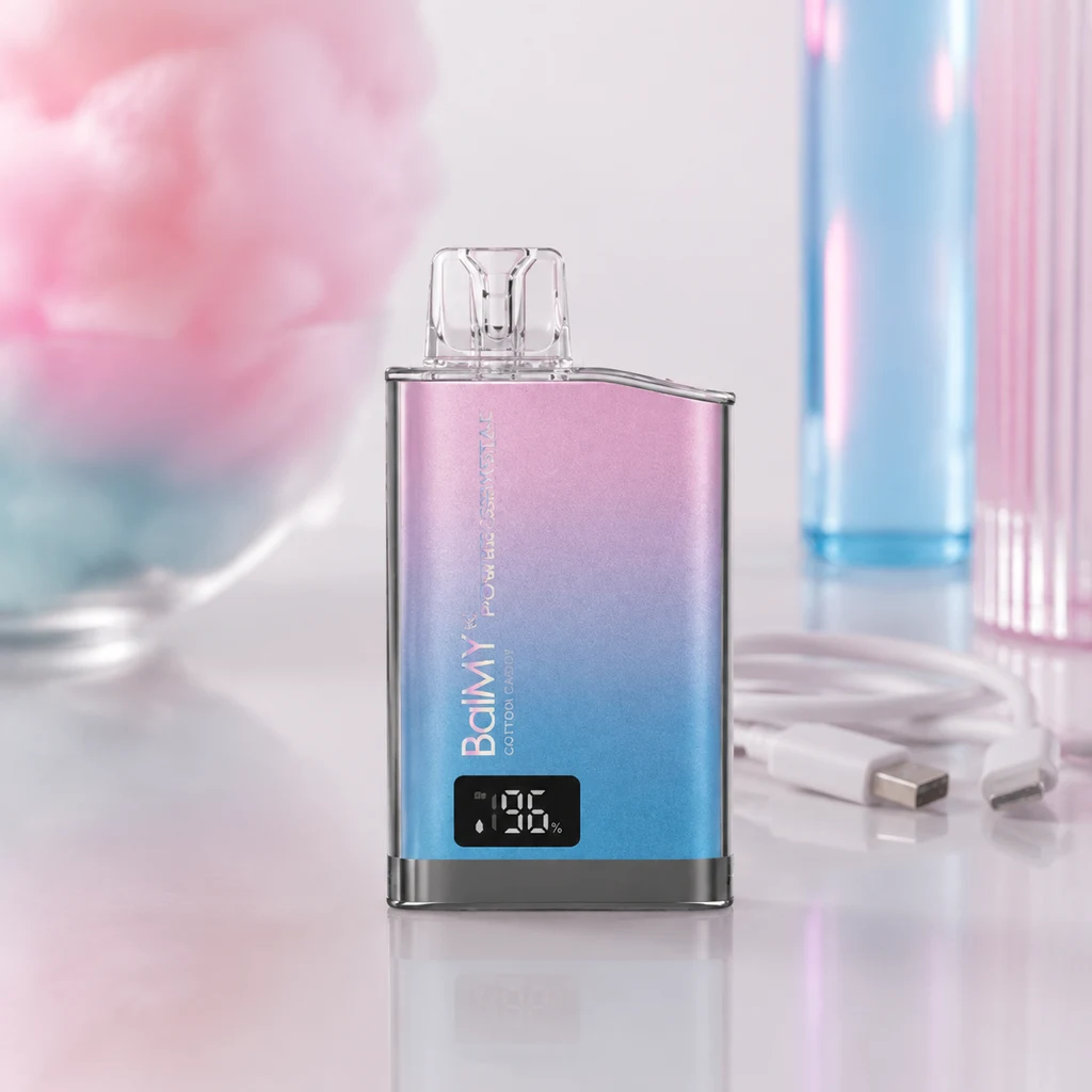 Escena generada de un Balmy Power Crystal rosa y azul, con boquilla transparente y pantalla al 96 %, sobre una mesa junto a un cable USB.