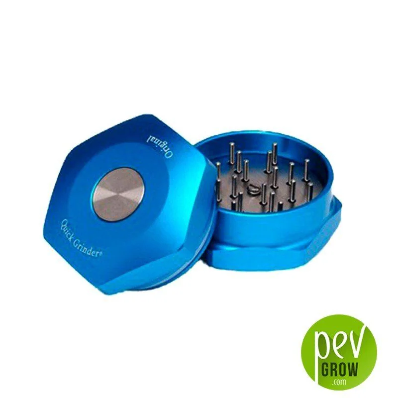 Quick Grinder Original azul abierto, con tapa apoyada a un lado, disco central plateado y varias púas interiores visibles sobre fondo blanco.