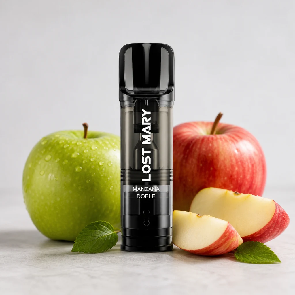 Lost Mary Doble Manzana negro con cuerpo translúcido, rodeado de manzanas verdes y rojas, gajos y hojas sobre una superficie clara.