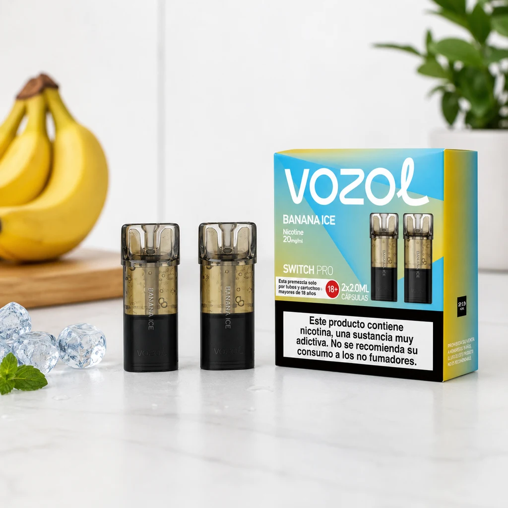 Recambios Vozol Switch Pro Banana Ice junto a su caja azul y amarilla sobre una encimera, con plátanos y cubitos de hielo alrededor.