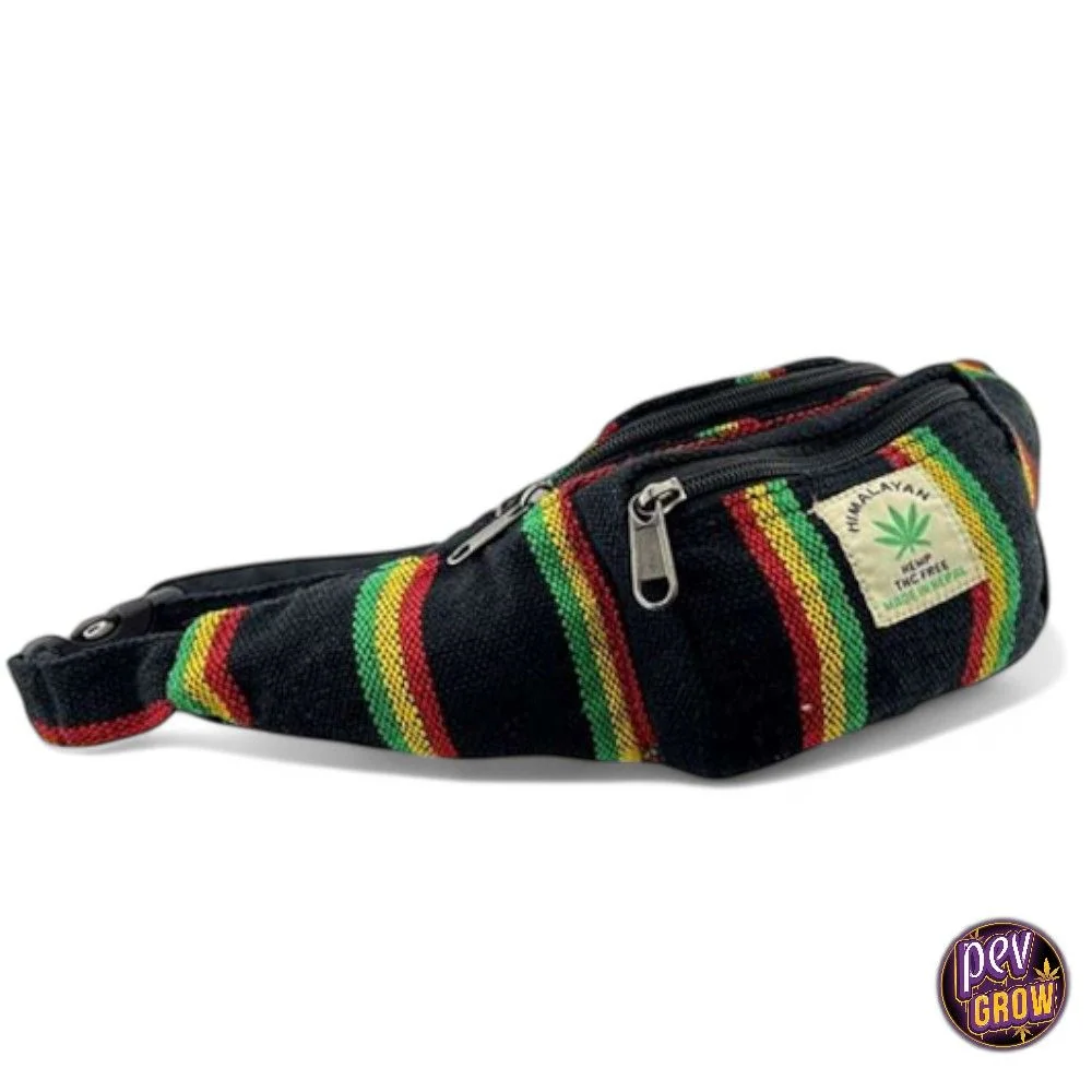 Riñonera Himalaya Hemp Rasta negra con franjas verdes, amarillas y rojas, bolsillos con cremallera y etiqueta con una hoja de cannabis.