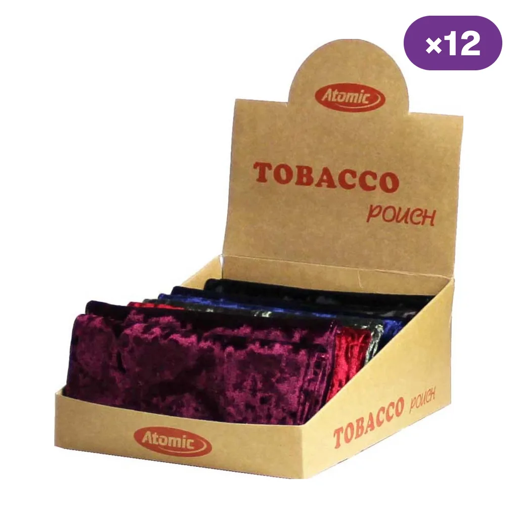 Expositor Atomic abierto con tabaqueras de terciopelo en varios colores, una de ellas granate en primer plano, e indicador de 12 unidades.