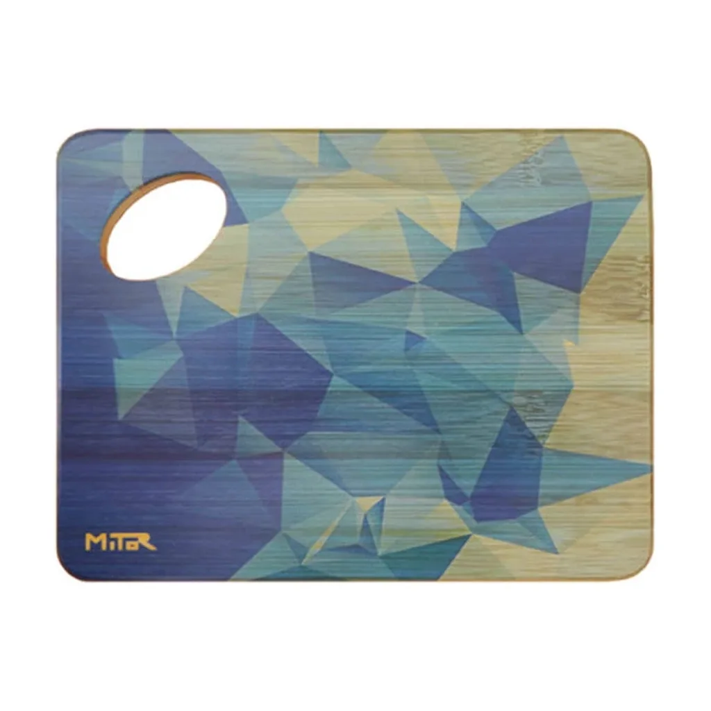 Tabla de mezcla rectangular con esquinas redondeadas, polígonos azules y verdes y una abertura ovalada en la esquina superior izquierda. Tabla de mezcla rectangular con esquinas redondeadas, polígonos azules y verdes y una abertura ovalada en la esquina superior izquierda.