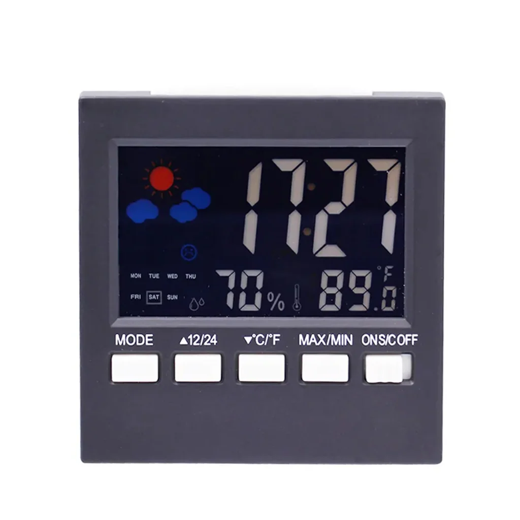 Termohigrómetro digital gris con pantalla que marca 17:27, humedad del 70 % y temperatura de 89,0 °F, con botones blancos inferiores. Termohigrómetro digital gris con pantalla que marca 17:27, humedad del 70 % y temperatura de 89,0 °F, con botones blancos inferiores.