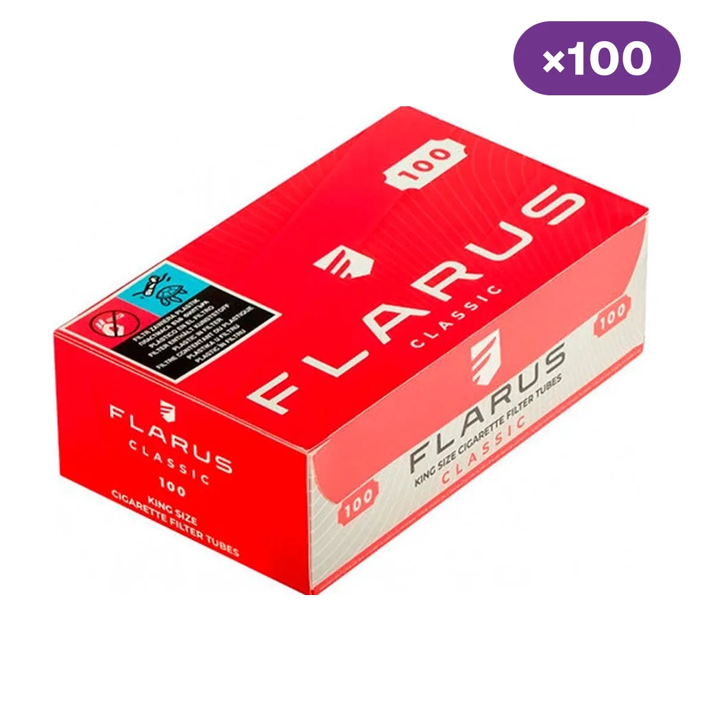 Caja roja de tubos Flarus Classic, vista en perspectiva, con la indicación de 100 tubos y un aviso sanitario en la tapa. Caja roja de tubos Flarus Classic, vista en perspectiva, con la indicación de 100 tubos y un aviso sanitario en la tapa.