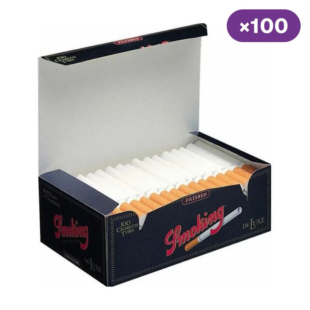 Caja abierta Smoking De Luxe con tubos blancos y filtros de color marrón claro alineados; distintivo de 100 unidades.