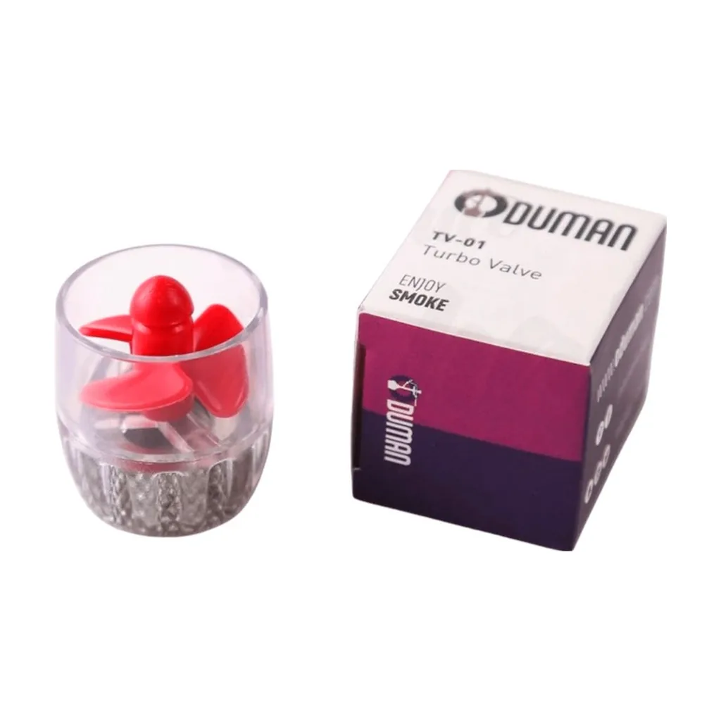 Válvula Oduman Turbo con cuerpo transparente, hélice roja y base plateada, junto a su caja blanca y morada. Válvula Oduman Turbo con cuerpo transparente, hélice roja y base plateada, junto a su caja blanca y morada.