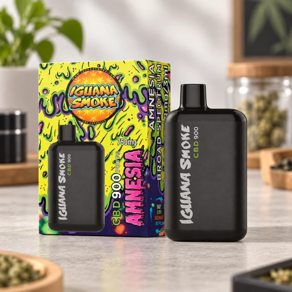Vaper de CBD Iguana Smoke Amnesia negro junto a su caja verde con grafismos multicolor, sobre una encimera.