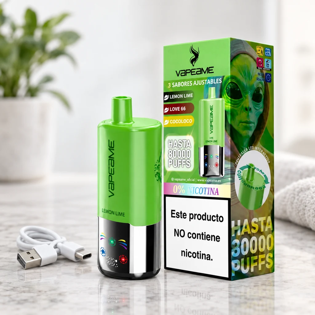 Vapeame 3 en 1 verde con base cromada y símbolos luminosos, junto a su caja con ilustración de alienígena y un cable USB.