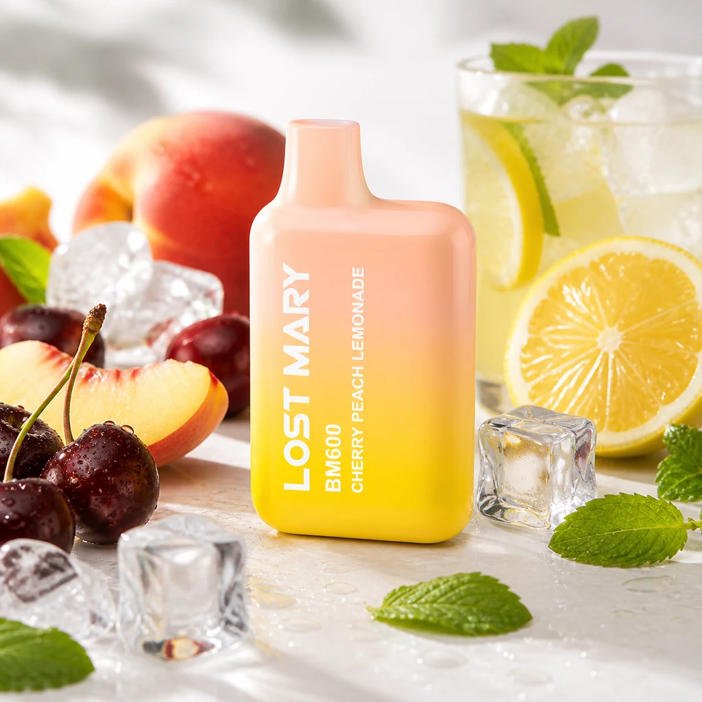Lost Mary BM600 Cherry Peach Lemonade en degradado melocotón y amarillo, rodeado de cerezas, melocotón, limón, hielo y menta.
