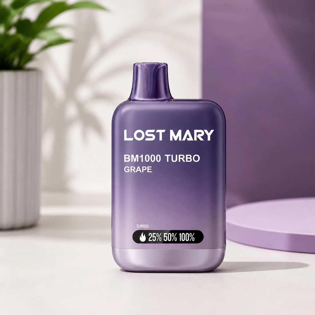 Lost Mary BM1000 Turbo Grape morado sobre una mesa clara, con indicador frontal y una planta desenfocada al fondo.